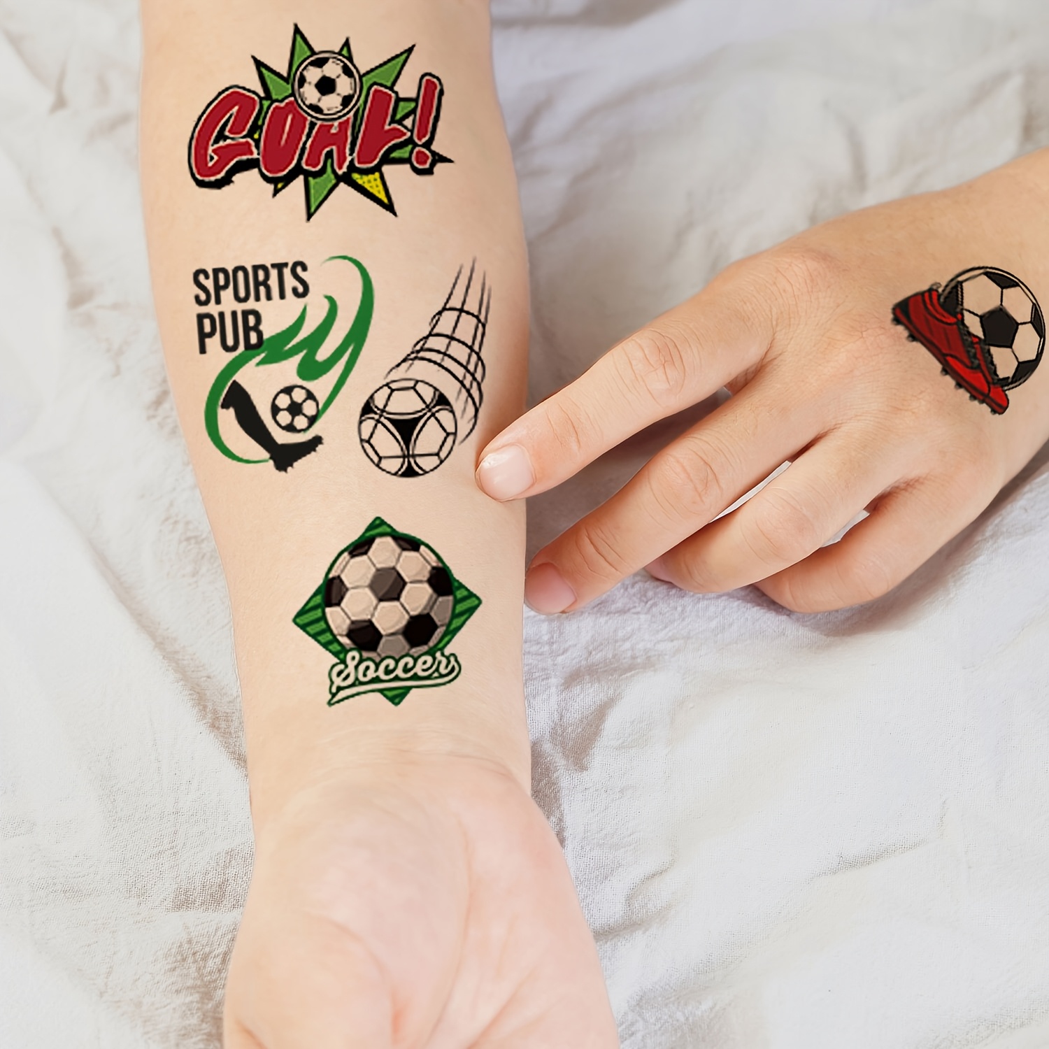 12 sheets with 112 designs of football tattoo stickers, featuring fun cartoon football elements. temporary body, arm, and face makeup fake tattoos suitable for football fans 12 sheets with 112 designs of football tattoo stickers, featuring fun cartoon football elements. temporary body, arm, and face makeup fake tattoos suitable for football fans